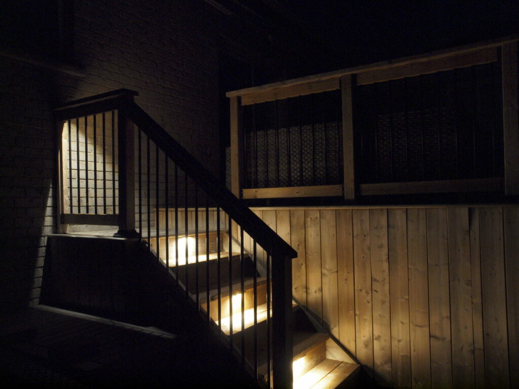The stairs are lit up at night.
