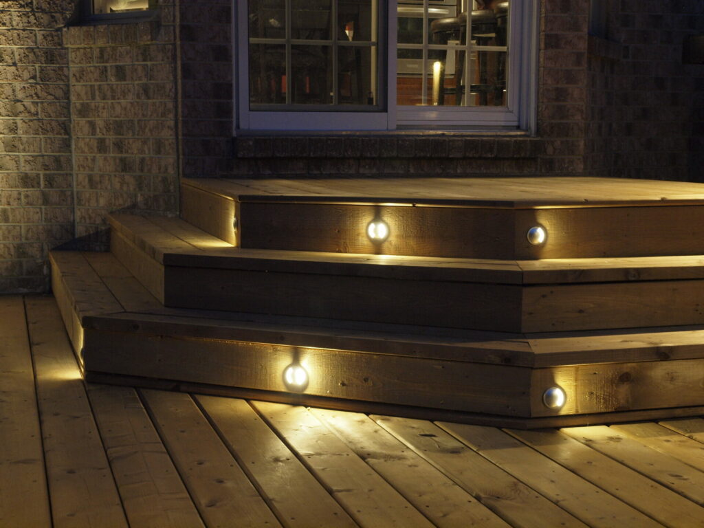 The steps are made of wood and are lit up at night.