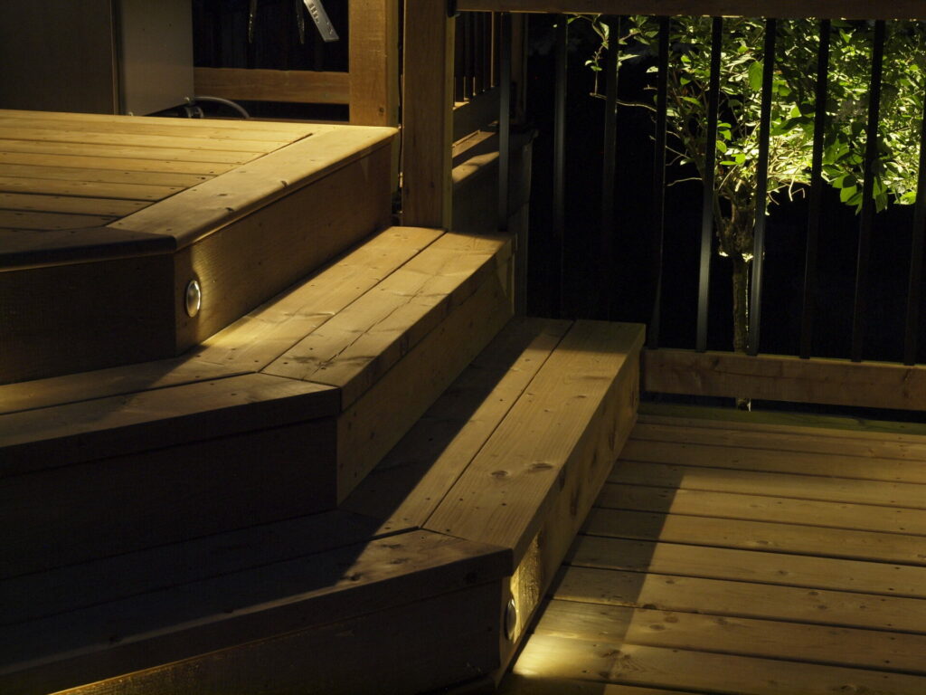 The lit up stairs are made of wood.